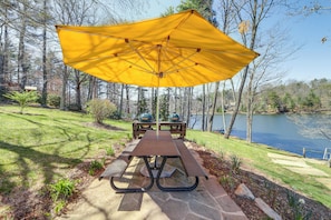 Patio | Outdoor Dining Area | 2 Charcoal Grills | Lake & Mountain Views