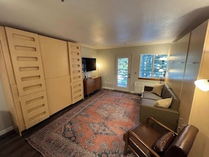 When all of the beds are tucked away, here is what the living room looks like.