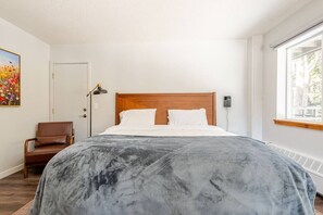 Cozy bed guests rave about, with stunning forest and mountain views right from bed—perfect for work and play in a stylish, serene retreat.