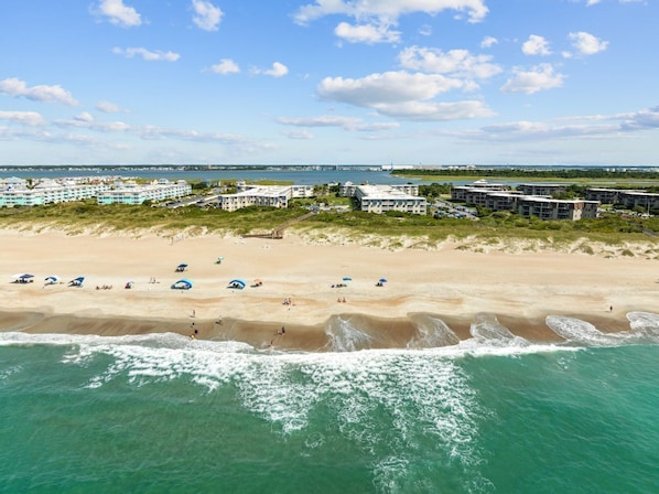Experience the ultimate beachfront getaway with direct access to sandy shores, stunning ocean and sound views, and proximity to Fort Macon and Morehead City.