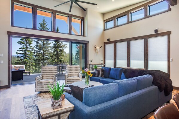 Great room with 10-seat dining table, 5 bar seats, gourmet kitchen, cozy living room and huge deck with outdoor seating and fire pit. | Upper Level