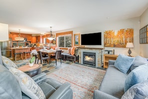 Spacious Living Room with Cozy Furnishings and Smart TV