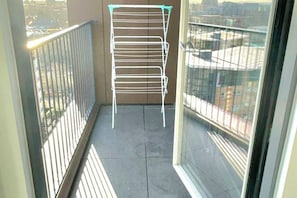 Access the balcony from the living room or the bedroom
