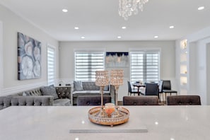Dine, relax, and gather in this beautifully styled living area.