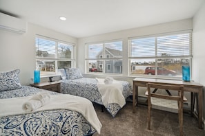 Bedroom #3! With a desk perfect from working from home and two twin beds. Clean linens provided