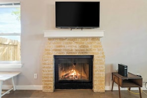 Wood burning fireplace and 43" HD Roku TV