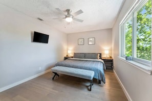 Master bedroom with King bed, 32" HD Roku TV, nightstand w/ USB lamps, ceiling fan