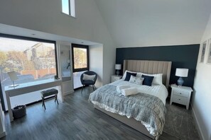 master bedroom with vaulted ceiling