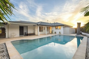 Take a cooling dip in the large private pool, surrounded by tropical gardens and just steps from your patio lounge.