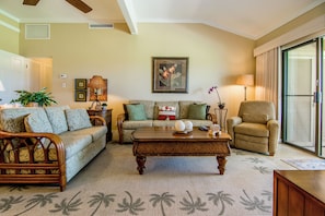 The inviting living room features plush seating and serene views, perfect for relaxed evenings in. A sleeper sofa allows for guests number 5 & 6. A great spot for kids or young teens.