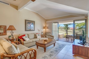 The inviting living room features plush seating and serene views, perfect for relaxed evenings in. A sleeper sofa allows for guests number 5 & 6. A great spot for kids or young teens.