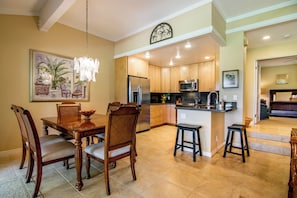 The open kitchen with breakfast bar and adjacent dining space makes entertaining effortless.