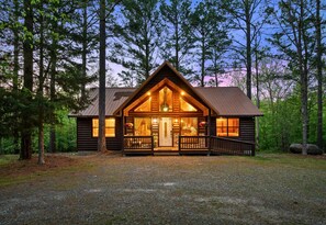 Framed by towering pines and a wide-open clearing, this charming cabin is the perfect launching point for your adventures.