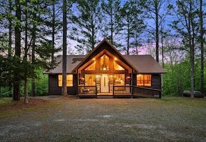 Framed by towering pines and a wide-open clearing, this charming cabin is the perfect launching point for your adventures.