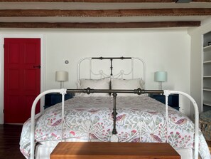 Queen sized bed with fresh bedding