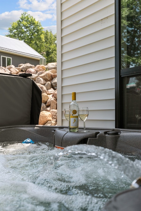 Relax and unwind in the private hot tub—perfect for soothing soaks after a day on the lake.