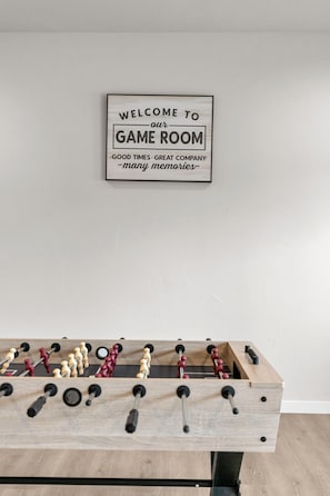 Let the friendly competition begin! Gather around the foosball table downstairs for laughs, quick hands, and unforgettable game nights with family and friends.