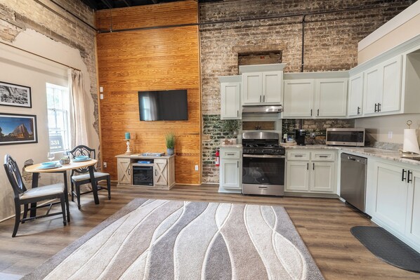 Cozy living space with natural light & a charming window nook — ideal for sipping coffee, journaling, or planning your Home Town adventures in Downtown Laurel. 
