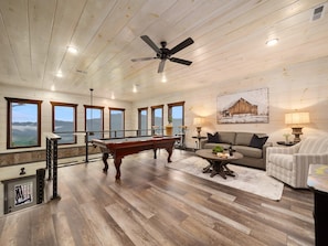 Fun-filled game room with stunning mountain views.