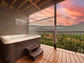 Soak in the views: Hot tub with mountain vistas.