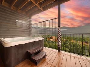 Soak in the views: Hot tub with mountain vistas.
