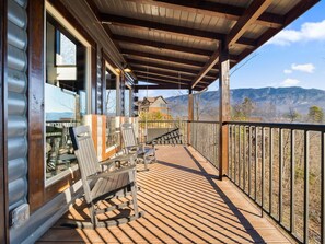 Please excuse the appearance of the mountain view, as this photo was shot over winer when trees are gone. This house features panoramic views of the mountains.