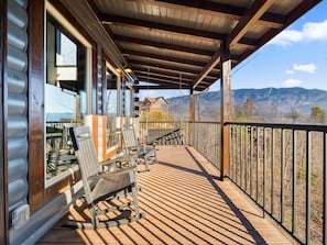 Please excuse the appearance of the mountain view, as this photo was shot over winer when trees are gone. This house features panoramic views of the mountains.