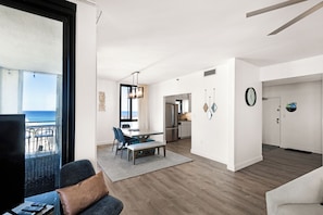 Looking towards the dining area and front entrance from the living room.