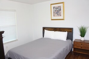 Minimalist decor meets cozy comfort in this bedroom