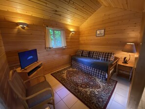 Tucked away is a trundle bed for extra guest sleeping or for curling up to watch a little TV.
