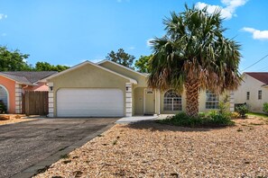 The home offers a private drive and garage
