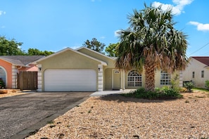 The home offers a private drive and garage