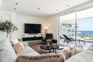 Cozy up in this inviting living space with ocean views and modern comforts.