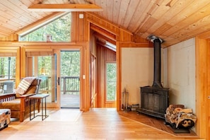 Warm and inviting living room with wood-burning fireplace