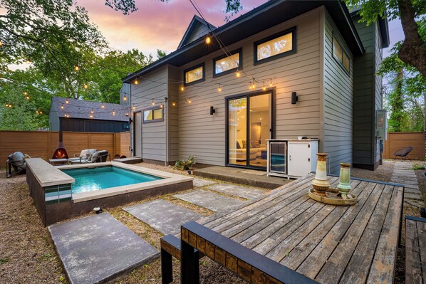Outdoor space featuring a private pool, seating area, and cozy firepit—perfect for relaxing days and evenings under the stars.