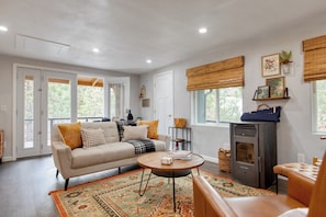 Cozy living room with a modern rustic vibe and natural light.