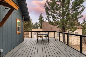 Outdoor dining space with stunning sunset views.