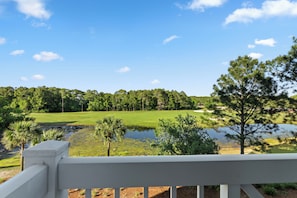 Enjoy peaceful mornings with serene garden and pond views.