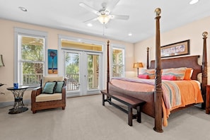 Wake up in comfort with natural light streaming through the large windows and private patio doors.
