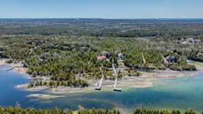 Escape to nature with this hidden lakeside gem! Surrounded by forest and steps from the water, this vacation rental offers total seclusion, private docks, and breathtaking views.
