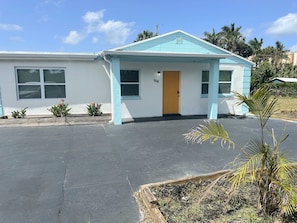 Coastal 4BR home just 1 block from the Intracoastal! Turfed, fenced yard + plenty of parking.
