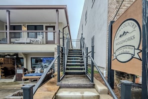 exterior steps up to Unit C on the right side of building