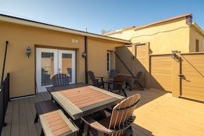 Through the gate and onto the deck and front door of apartment