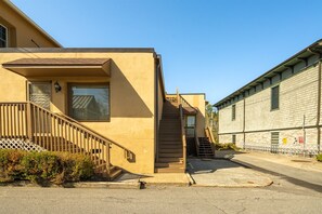 Stairs up to Penthouse, parking pad at bottom of stairs