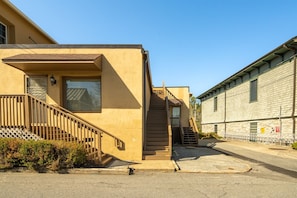 Stairs up to Penthouse, parking pad at bottom of stairs