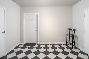second floor lobby, go to Unit 5 door