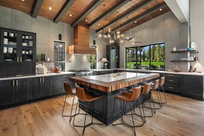 Living the Dream: - Fully stocked chef's kitchen with tile walls and seating for 6.