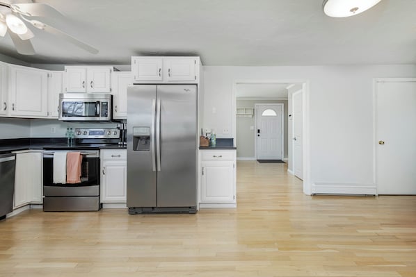 Kitchen with Dining room in background