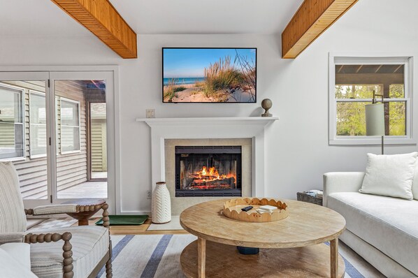 Welcome to Forest House —where rustic beams meet modern comfort. This living room glows with charm!