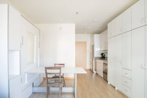 Murphy bed folded up into dining table/workspace